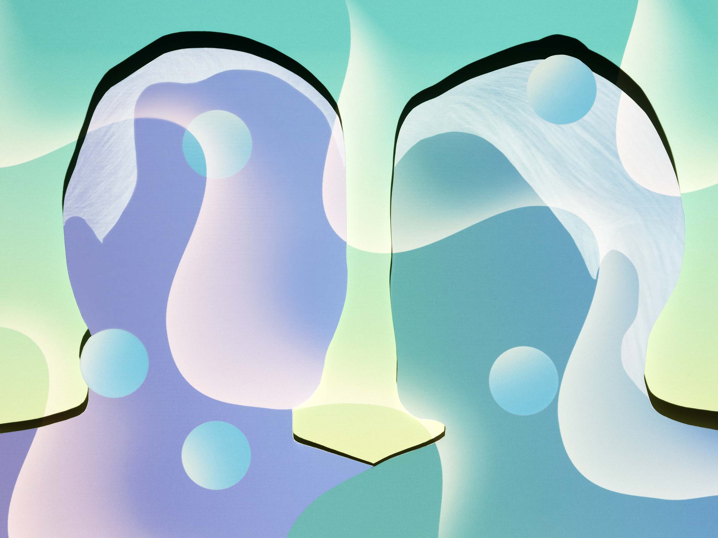 Illustration of two faces with multiple spheres in front of them