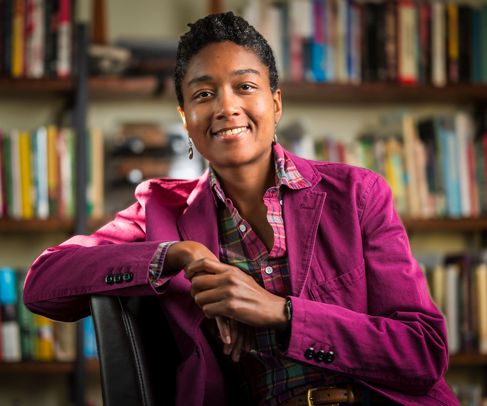 Portrait of Ashley Brown in front of bookshelves