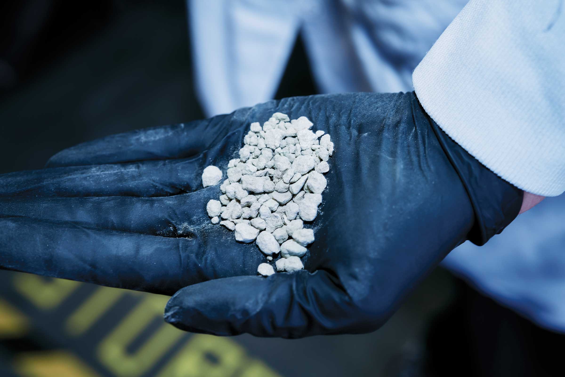 Liz Dennett holds stones in her hand