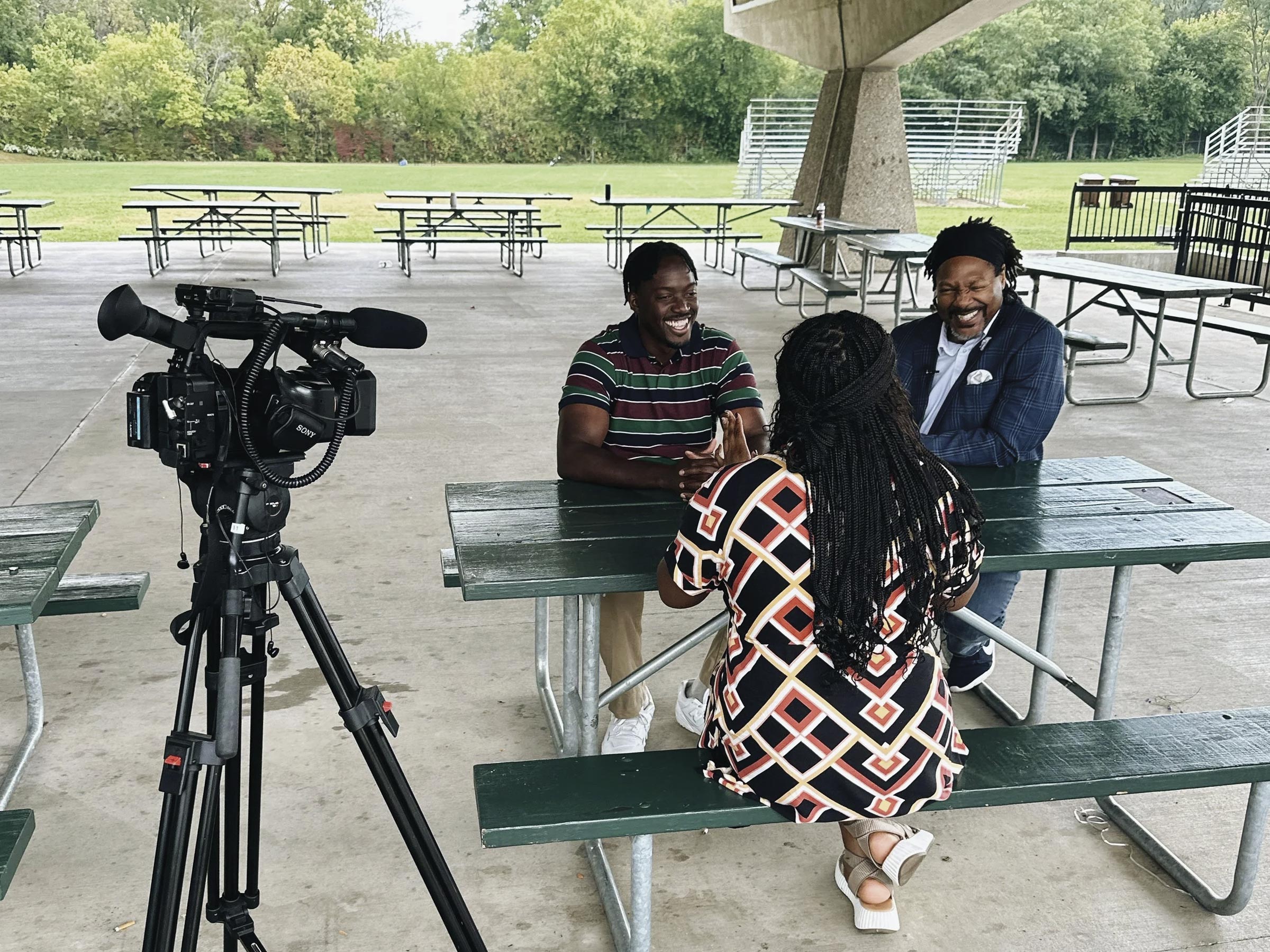 A reporter interviews two a researcher and participant for the SoulFolk Collective