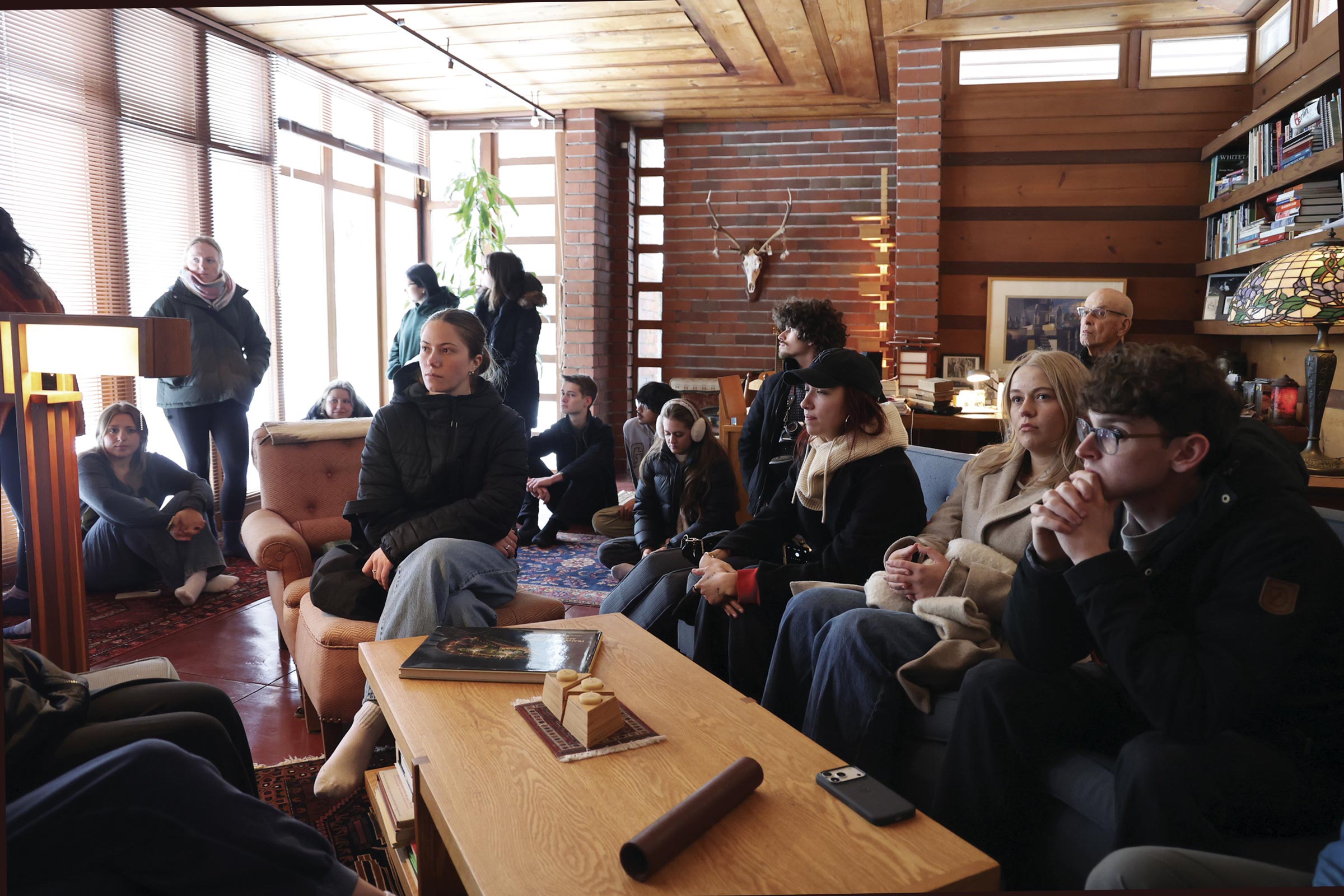 Students listen to Anna Andrzejewski during a Frank Lloyd Wright house tour