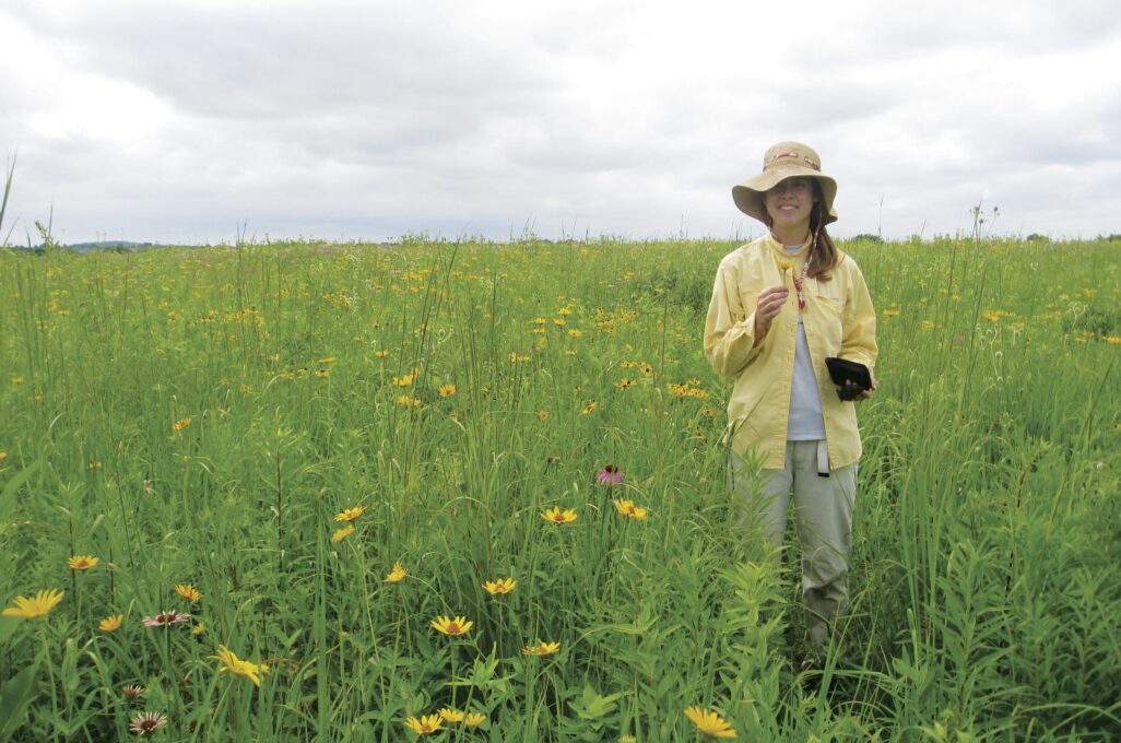 Photo of Evelyn Williams in a wildflower field